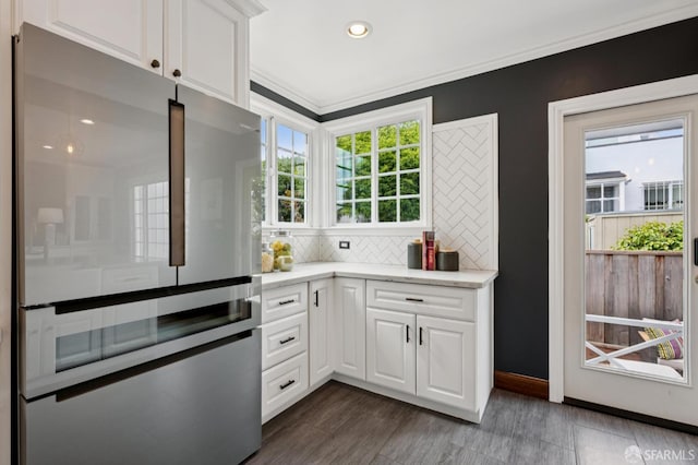 20 Rossmoor Dr, San Francisco, CA 94132 - kitchen featuring stainless steel refrigerator, tasteful backsplash, white cabinetry, light stone counters, and recessed lighting