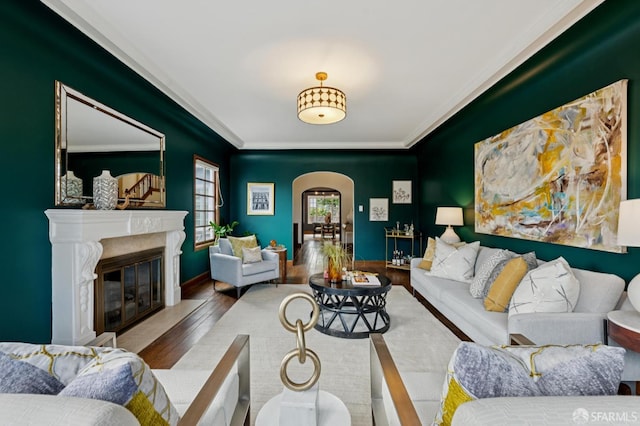 20 Rossmoor Dr, San Francisco, CA 94132 - living room featuring arched walkways, wood finished floors, crown molding, a fireplace, and baseboards