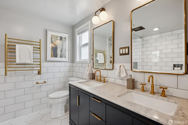 20 Rossmoor Dr, San Francisco, CA 94132 - full bathroom with radiator heating unit, tile walls, double vanity, toilet, and a towel warmer