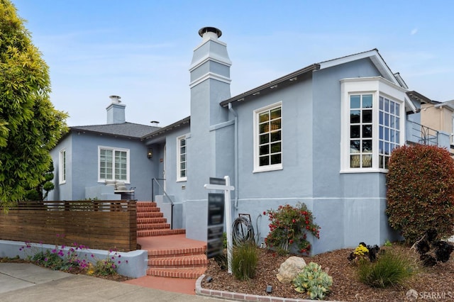 20 Rossmoor Dr, San Francisco, CA 94132 - view of front facade featuring a chimney and stucco siding