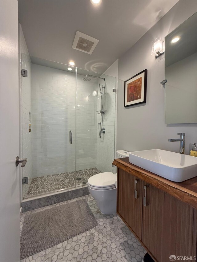 2543 44th Ave, San Francisco, CA 94116 - bathroom featuring toilet, a stall shower, vanity, and recessed lighting