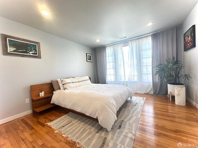 2543 44th Ave, San Francisco, CA 94116 - bedroom with baseboards, light wood finished floors, and recessed lighting