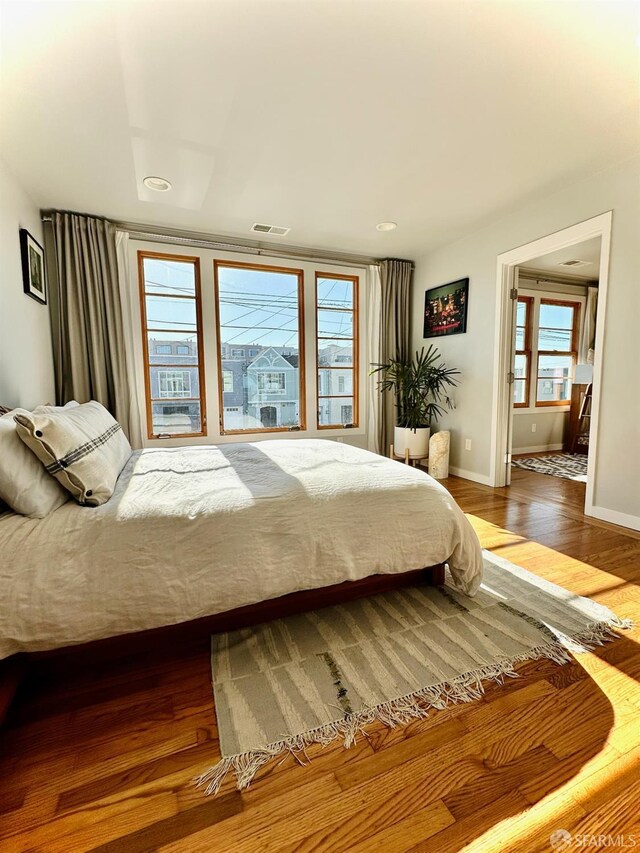 2543 44th Ave, San Francisco, CA 94116 - bedroom with baseboards, wood finished floors, and recessed lighting