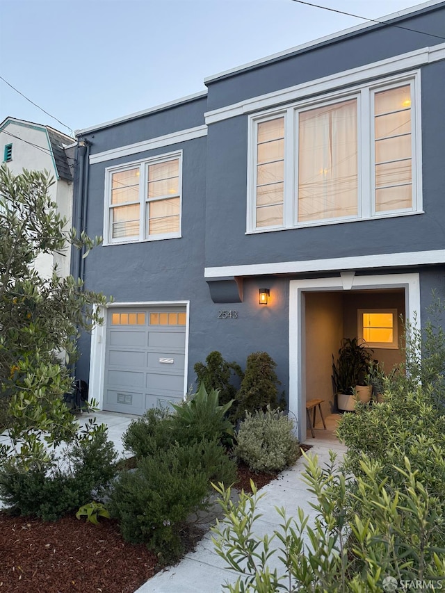 2543 44th Ave, San Francisco, CA 94116 - view of front facade featuring stucco siding and an attached garage