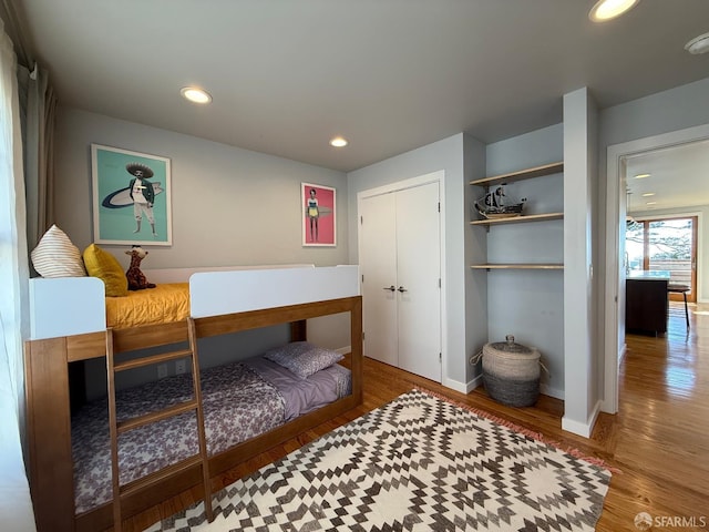 2543 44th Ave, San Francisco, CA 94116 - bedroom featuring wood finished floors, a closet, baseboards, and recessed lighting