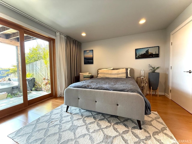 2543 44th Ave, San Francisco, CA 94116 - bedroom featuring access to outside, wood finished floors, and recessed lighting