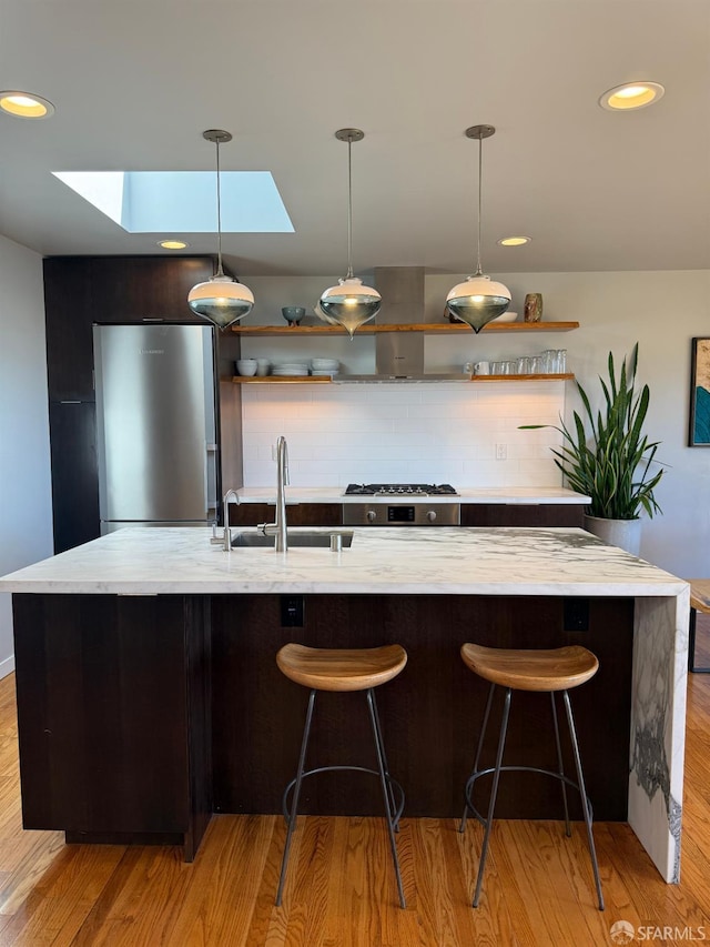 2543 44th Ave, San Francisco, CA 94116 - kitchen featuring stainless steel appliances, a sink, a skylight, open shelves, and decorative backsplash