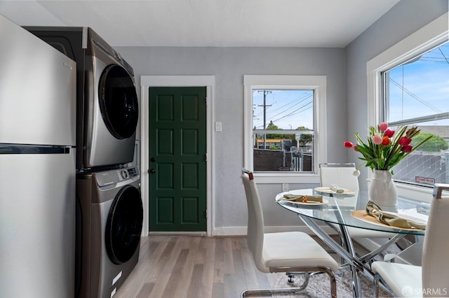 3644 Redding St, Oakland, CA 94619 - laundry room featuring estacked washer and dryer and wood finished floors