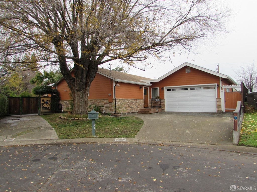 ranch-style house featuring a garage