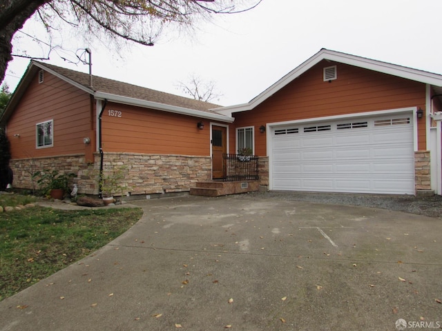 ranch-style house featuring a garage