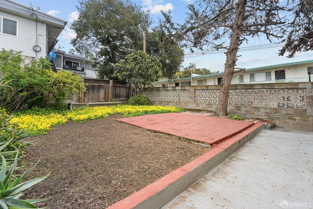 view of yard with a patio and fence
