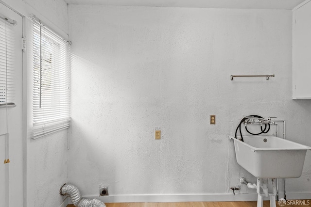 bathroom with a sink and wood finished floors