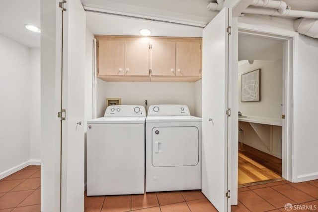 25 Roselyn Ter, San Francisco, CA 94118 - clothes washing area featuring cabinet space, separate washer and dryer, light tile patterned floors, and baseboards