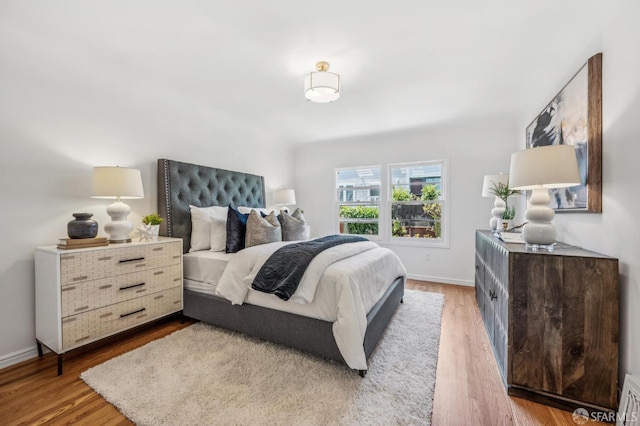 25 Roselyn Ter, San Francisco, CA 94118 - bedroom with light wood-type flooring and baseboards