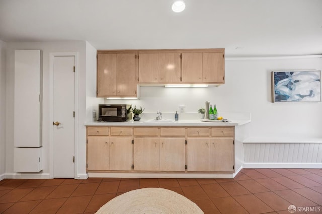 25 Roselyn Ter, San Francisco, CA 94118 - kitchen with black microwave, light countertops, a sink, dark tile patterned flooring, and light brown cabinetry