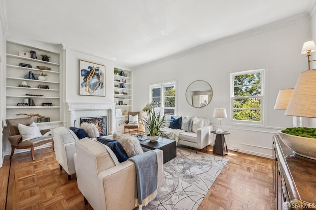 25 Roselyn Ter, San Francisco, CA 94118 - living room featuring ornamental molding, a lit fireplace, and built in shelves