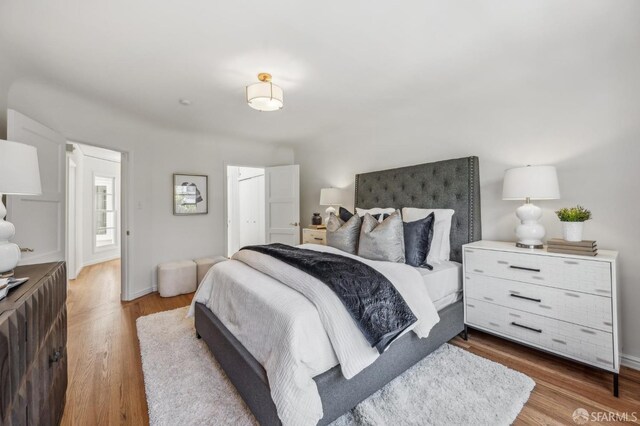 25 Roselyn Ter, San Francisco, CA 94118 - bedroom with wood finished floors, a closet, and baseboards
