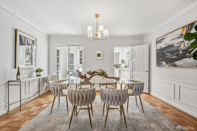 25 Roselyn Ter, San Francisco, CA 94118 - dining area featuring ornamental molding, a chandelier, a wainscoted wall, and a decorative wall