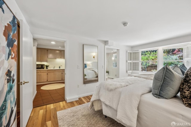25 Roselyn Ter, San Francisco, CA 94118 - bedroom with ensuite bathroom, light wood-type flooring, and recessed lighting