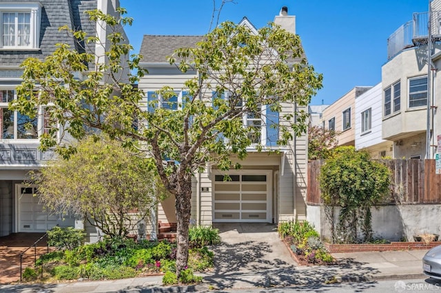 25 Roselyn Ter, San Francisco, CA 94118 - view of front of house with a garage, a chimney, concrete driveway, roof with shingles, and fence