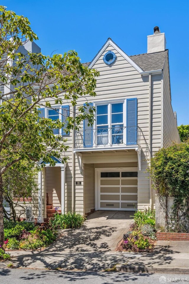 25 Roselyn Ter, San Francisco, CA 94118 - view of front of house featuring a chimney, concrete driveway, a shingled roof, and a garage