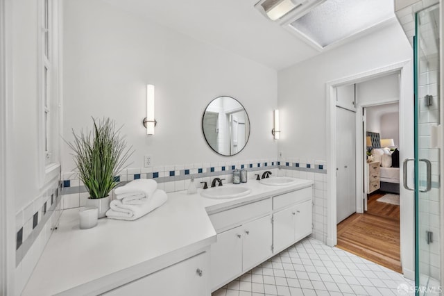 25 Roselyn Ter, San Francisco, CA 94118 - full bathroom featuring ensuite bathroom, double vanity, tile patterned floors, and tile walls