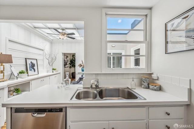 25 Roselyn Ter, San Francisco, CA 94118 - kitchen featuring dishwasher, a sink, light countertops, and white cabinets