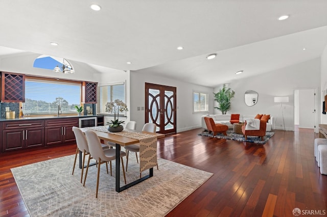 dining space featuring lofted ceiling, dark wood finished floors, recessed lighting, wine cooler, and baseboards