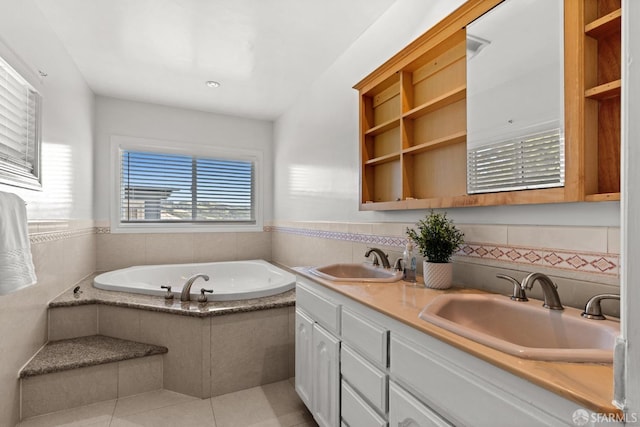 full bathroom with tile patterned flooring, double vanity, a bath, and a sink