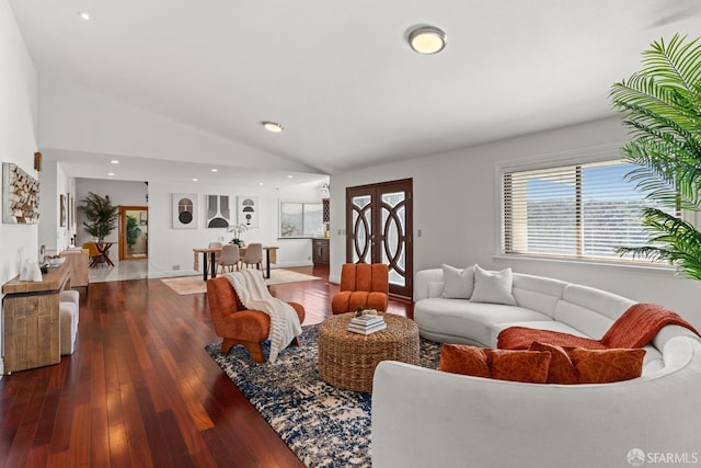 living area with vaulted ceiling, recessed lighting, and hardwood / wood-style flooring