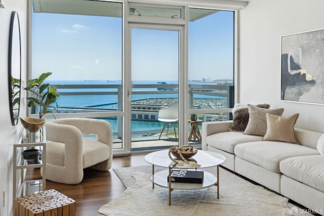 501 Beale St Unit 19B, San Francisco, CA 94105 - living area with floor to ceiling windows, healthy amount of natural light, a water view, and wood finished floors