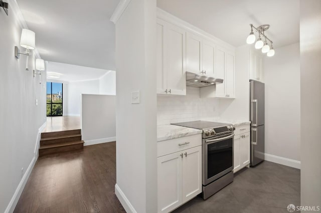 kitchen featuring light stone counters, white cabinets, backsplash, dark wood-type flooring, and stainless steel appliances