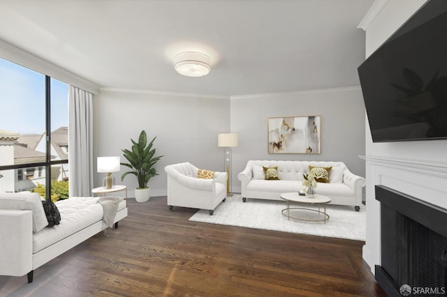 living room featuring ornamental molding and dark wood-type flooring