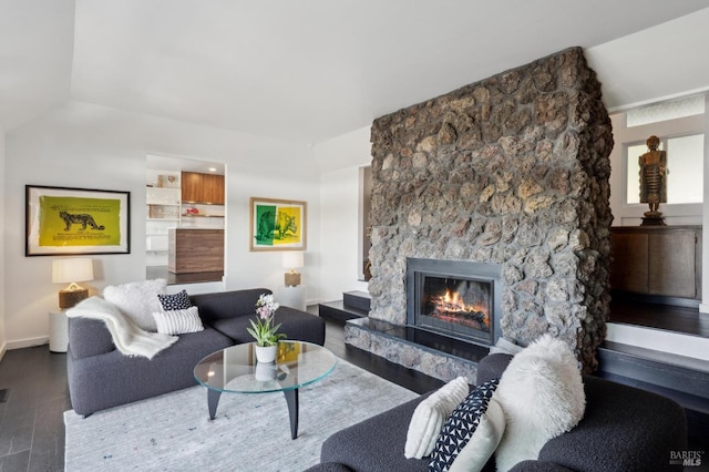 living area with a fireplace and wood finished floors