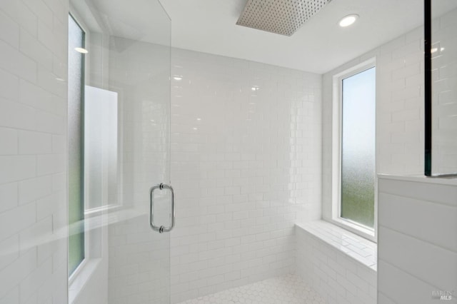 bathroom with recessed lighting and a stall shower