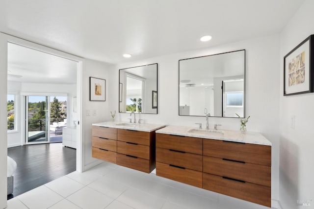 bathroom with tile patterned floors, recessed lighting, vanity, and baseboards