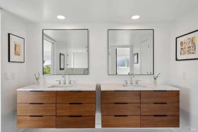 bathroom with vanity and recessed lighting