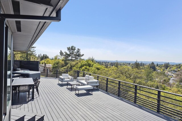 wooden deck featuring an outdoor hangout area