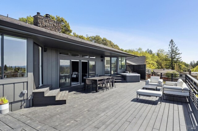 deck featuring an outdoor living space and outdoor dining area