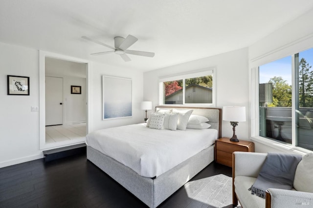 bedroom featuring dark wood-style flooring, ceiling fan, and baseboards