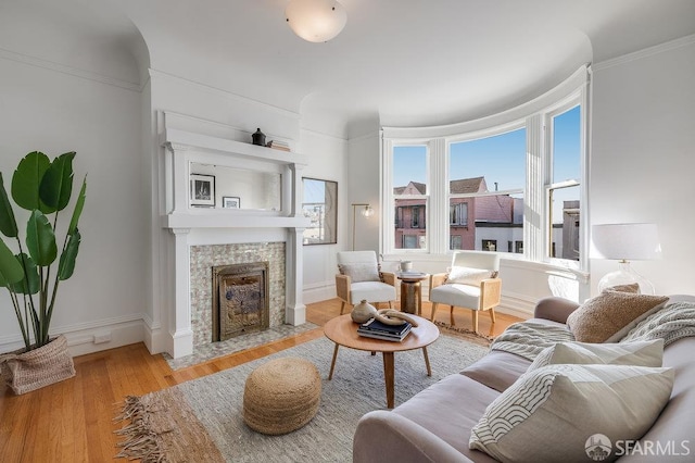 813 Union St, San Francisco, CA 94133 - living room featuring a tiled fireplace, wood finished floors, and crown molding