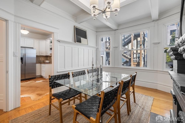 813 Union St, San Francisco, CA 94133 - dining room with beam ceiling, a chandelier, plenty of natural light, light wood-type flooring, and crown molding