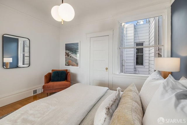 813 Union St, San Francisco, CA 94133 - bedroom with wood finished floors and crown molding