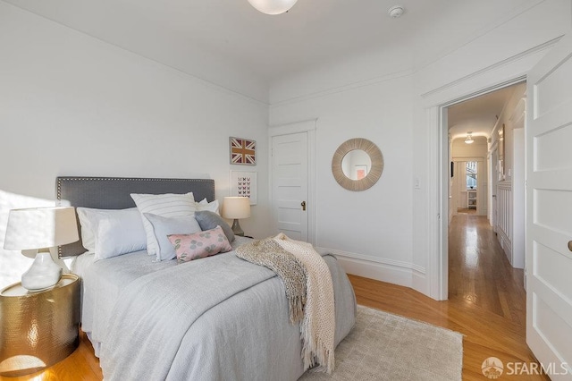 813 Union St, San Francisco, CA 94133 - bedroom with light wood-type flooring and baseboards