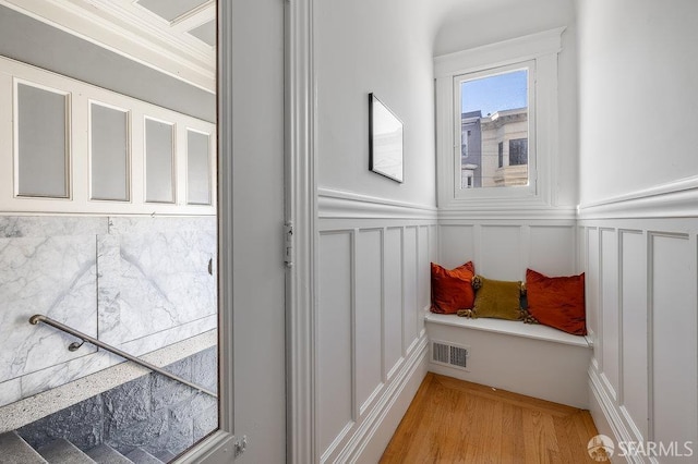 813 Union St, San Francisco, CA 94133 - interior space featuring a decorative wall, light wood finished floors, wainscoting, and ornamental molding
