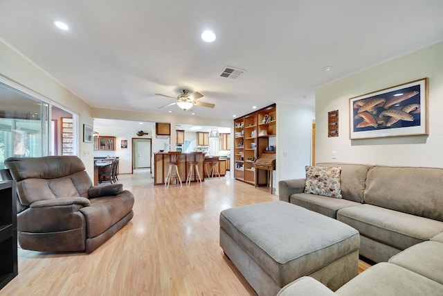 living room featuring visible vents, recessed lighting, light wood-style floors, and ceiling fan