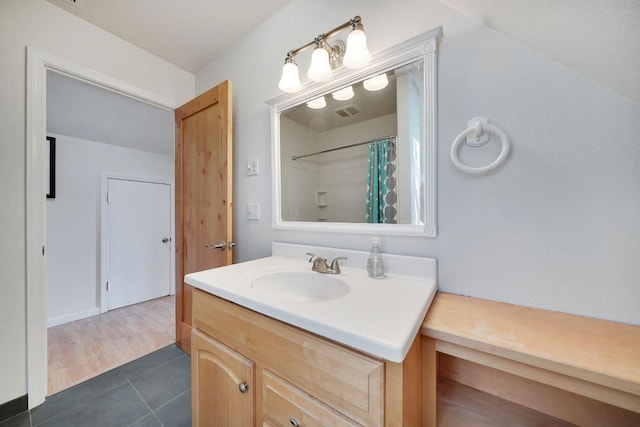 bathroom with visible vents, tile patterned floors, vanity, and curtained shower