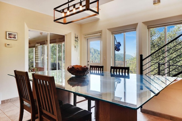 dining area featuring a healthy amount of sunlight and light tile patterned floors