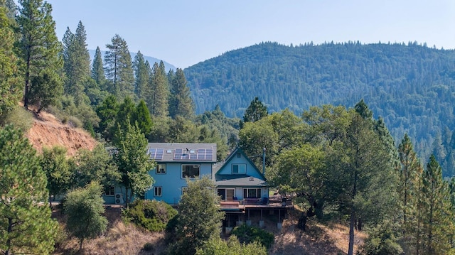 property view of mountains featuring a wooded view