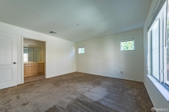 981 Asilomar Ter Unit 1, Sunnyvale, CA 94086 - unfurnished bedroom with carpet floors, multiple windows, and ensuite bathroom